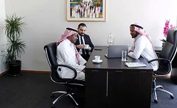 Receptionist helping clients at the front desk