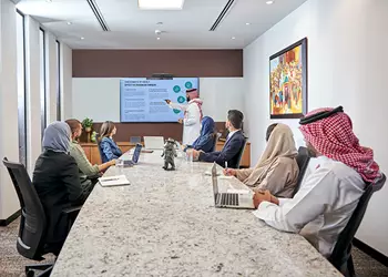 A professional team collaborates in a premium Servcorp boardroom in Saudi Arabia, utilizing state-of-the-art meeting facilities to drive business success.